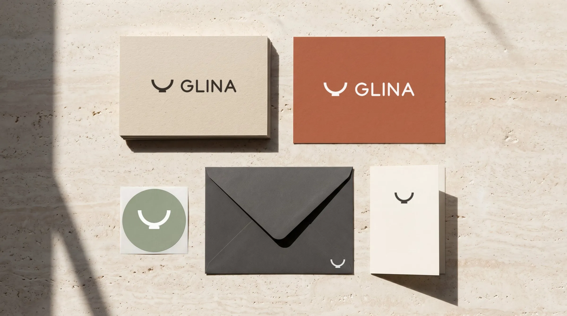 Business cards, postcard, sticker, envelope and care card.